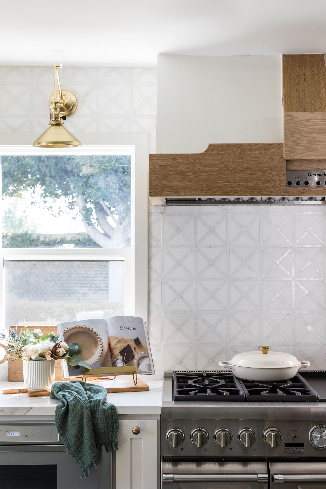 gorgeous backsplash tile in front of gas range in kitchen remodel