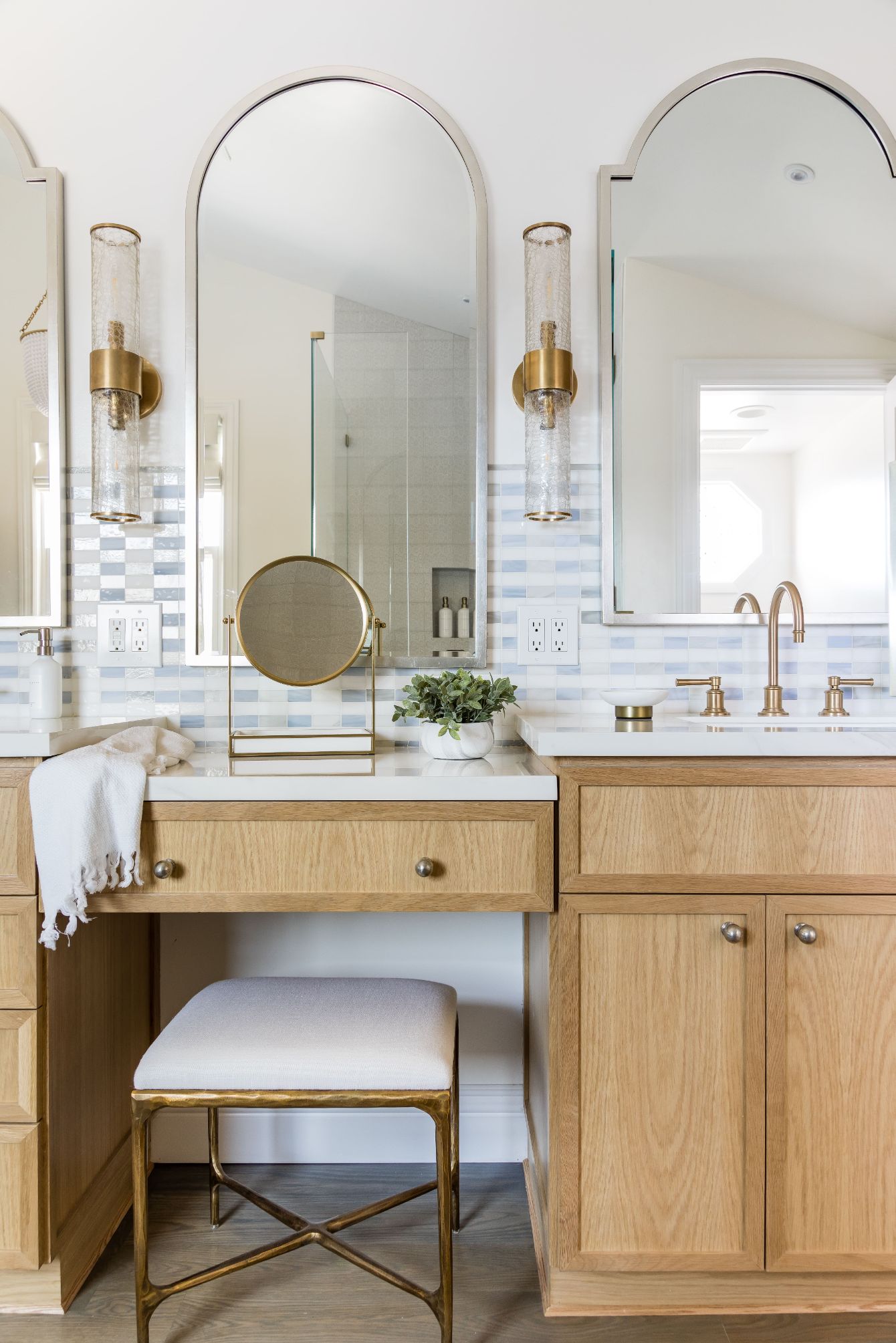 arched mirrors over vanity station in modern bathroom design