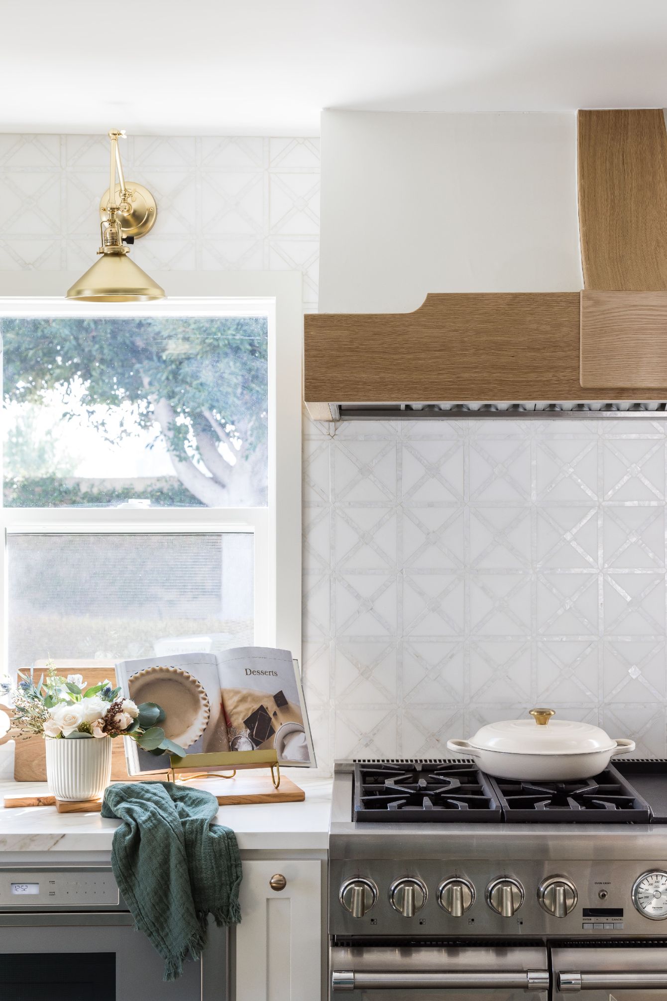 gorgeous backsplash tile in front of gas range in kitchen remodel