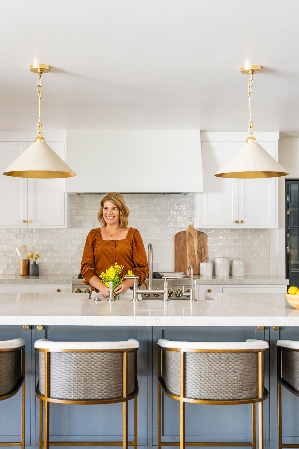 designer Amanda Sloan standing in a kitchen she designed