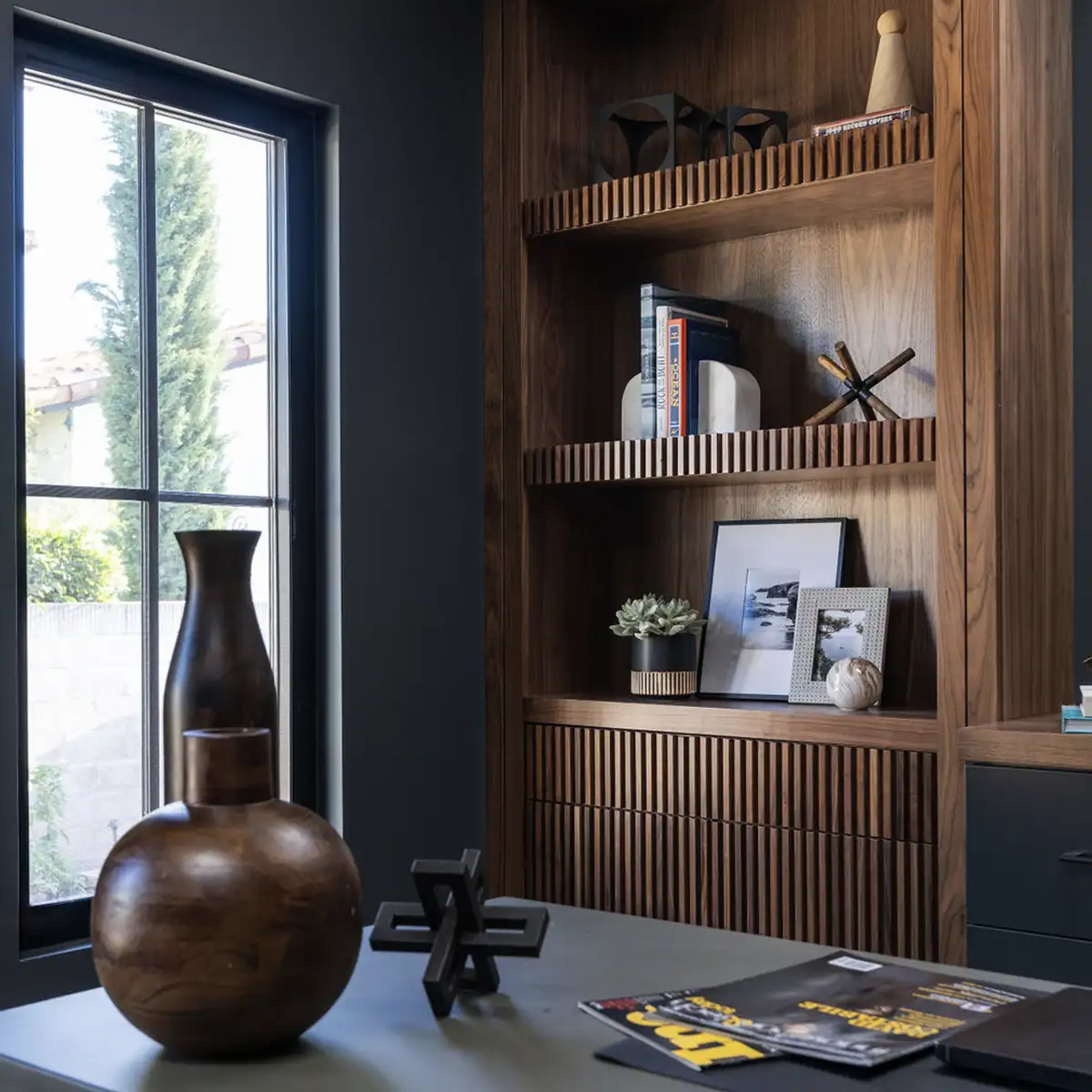 Home Office Interior Design with charcoal gray walls and very unique solid wood shelf