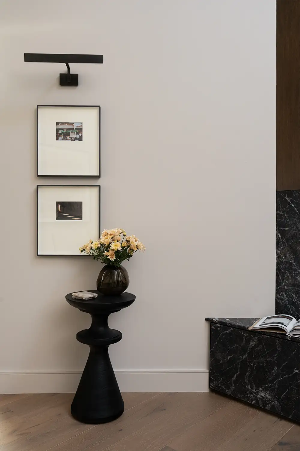 interior design detail with pedestal and wall art
