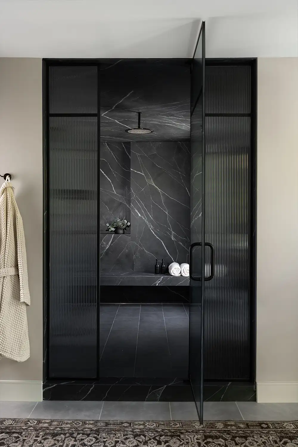 Interior design of a modern black bathroom in an Orange County CA home