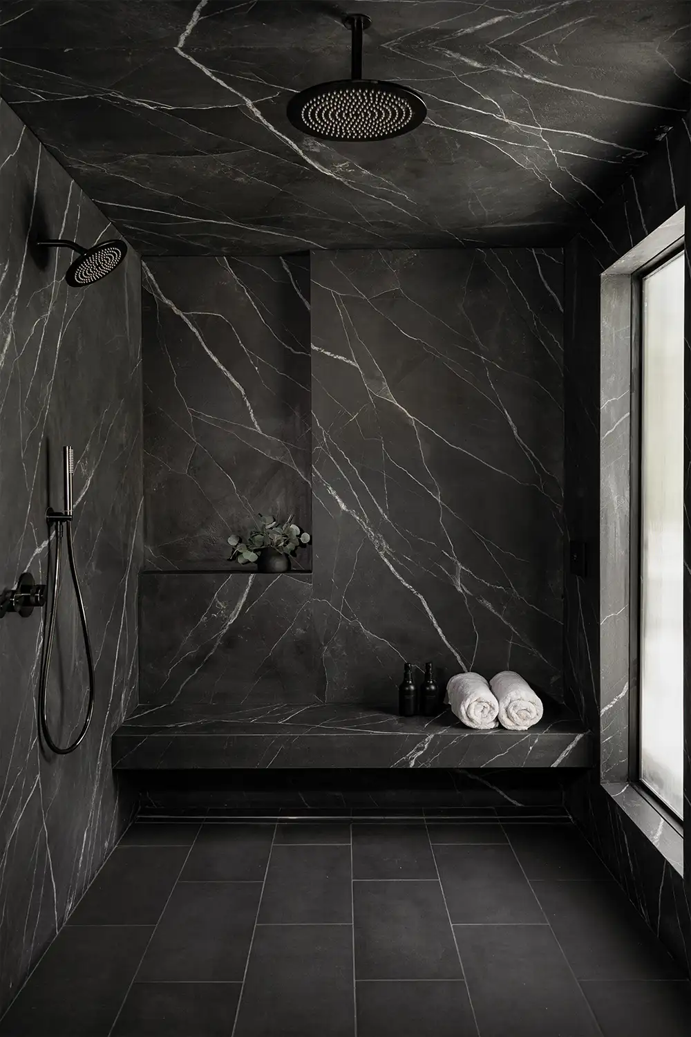 Beautiful modern shower with black tile in Orange County CA home