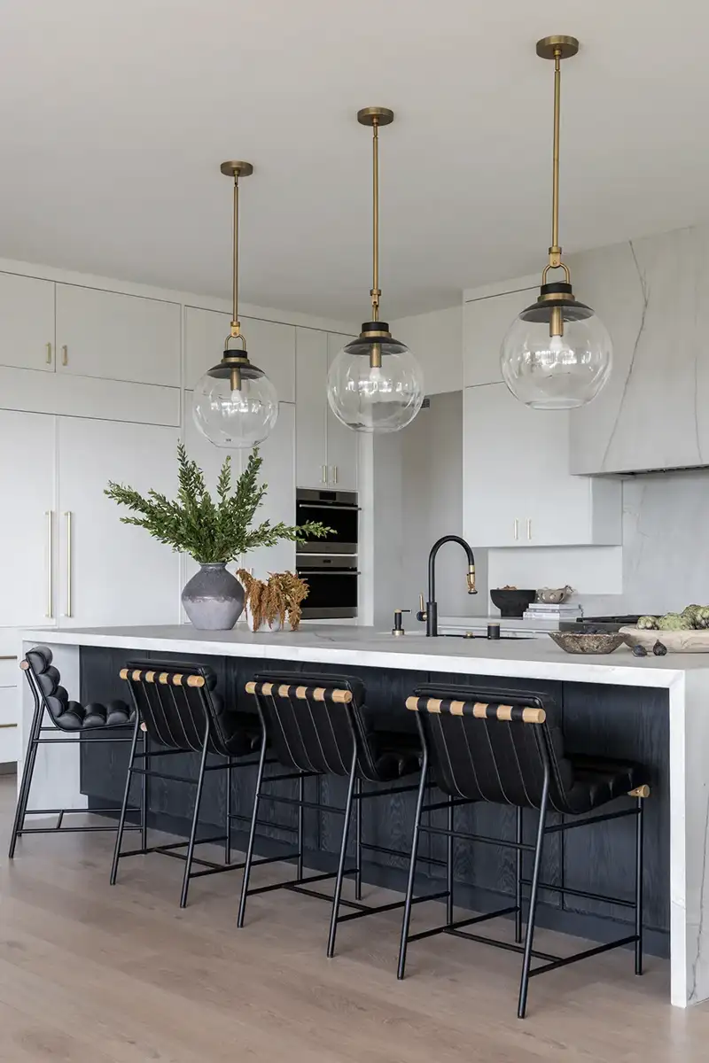Peralta Heights Interior Design Project with modern light fixtures and unique chairs at a kitchen island bar by Sloan Co Design